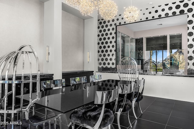 dining room with a notable chandelier and tile patterned floors