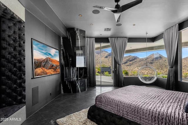 bedroom featuring access to outside, visible vents, a mountain view, and tile patterned floors