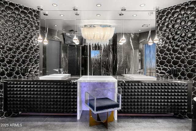 full bathroom featuring two vanities, a sink, and recessed lighting