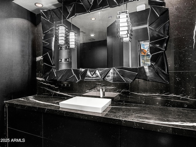 bathroom with decorative backsplash and vanity