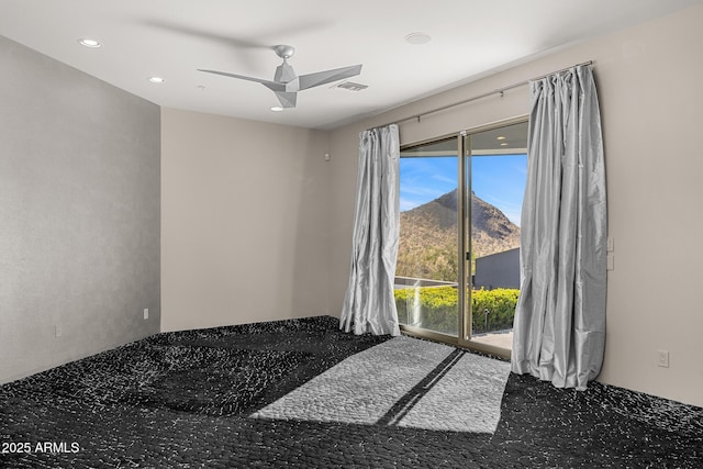 spare room featuring a ceiling fan and recessed lighting