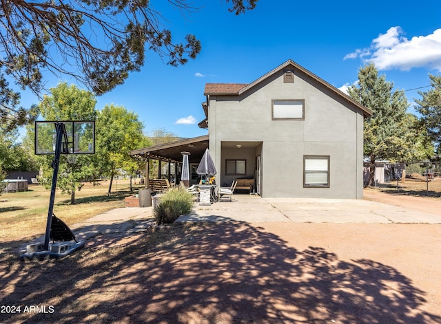 back of house featuring basketball court