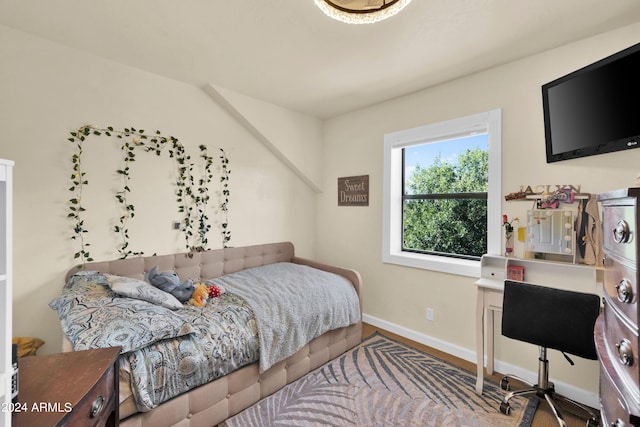 bedroom with hardwood / wood-style floors