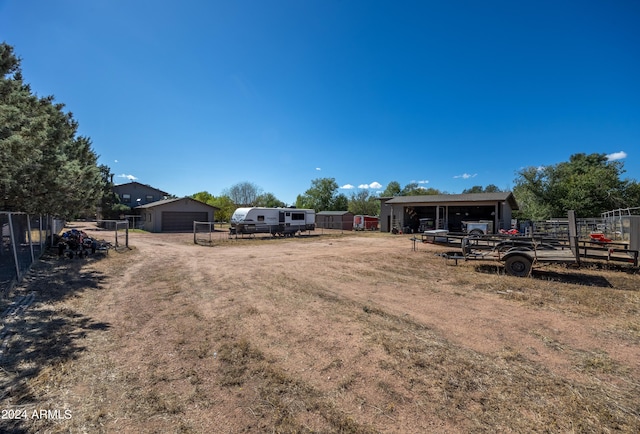 view of yard with an outdoor structure and a garage