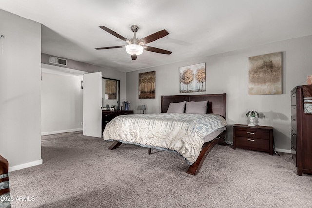 carpeted bedroom featuring ceiling fan, visible vents, and baseboards