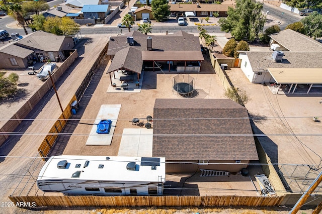 birds eye view of property with a residential view