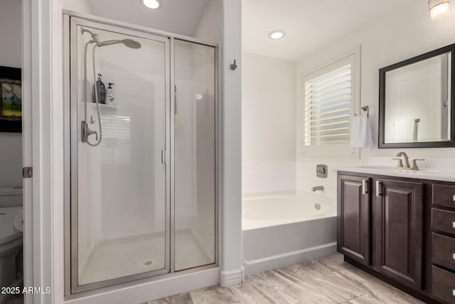 full bath with a garden tub, toilet, recessed lighting, vanity, and a stall shower