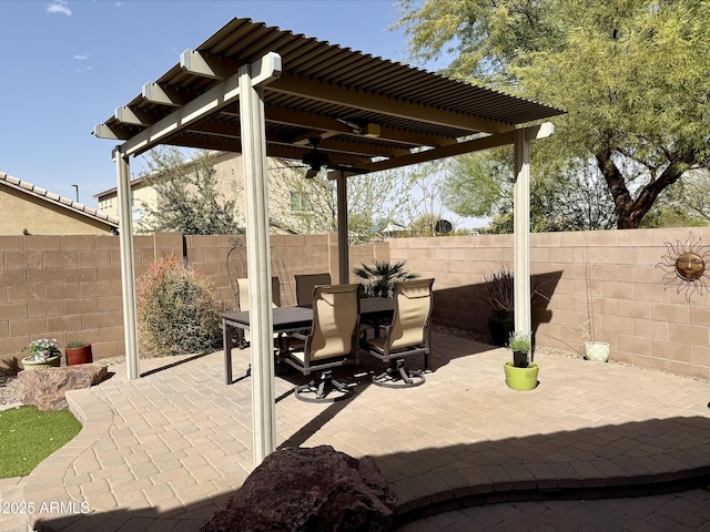 view of patio / terrace featuring a fenced backyard, outdoor dining area, and a pergola