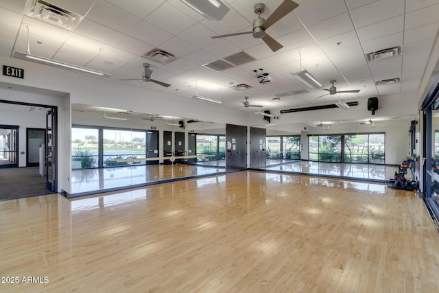 workout room with visible vents, plenty of natural light, and wood finished floors