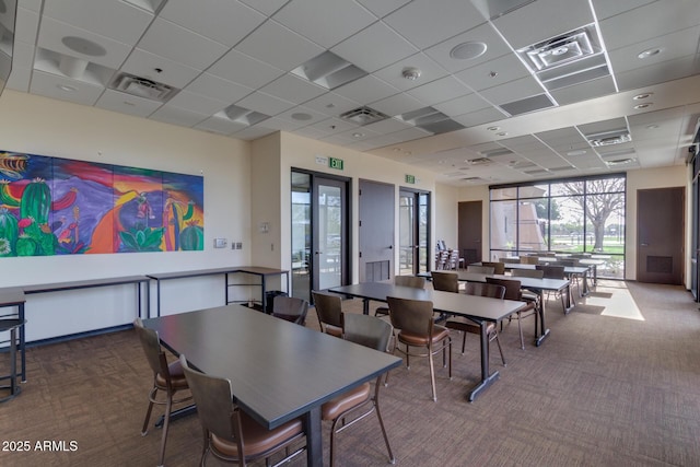 dining space with carpet floors and visible vents