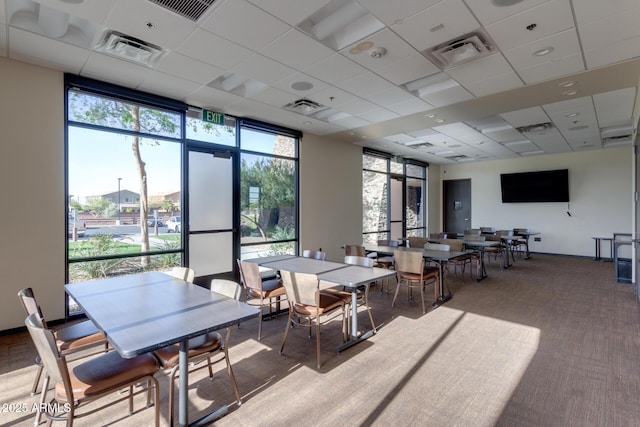 carpeted dining room with visible vents