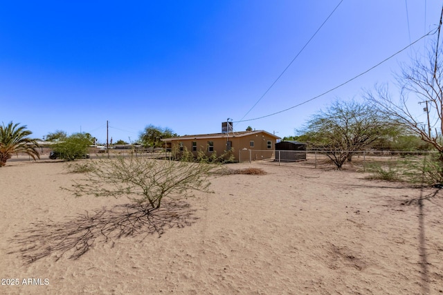 423 W Phoenix Ave, Eloy, AZ 85131 - exterior space featuring a gate, fence, and stucco siding