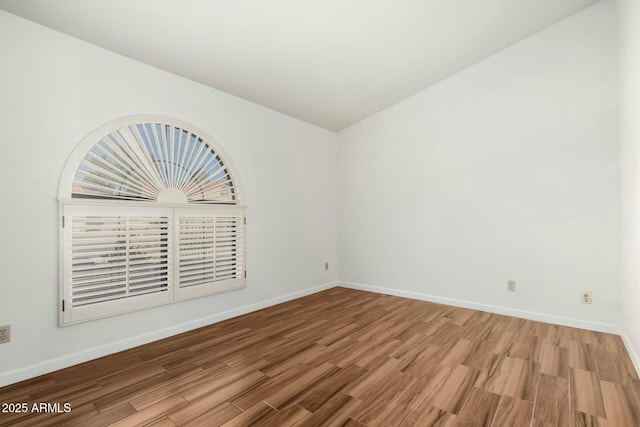 empty room featuring wood-type flooring