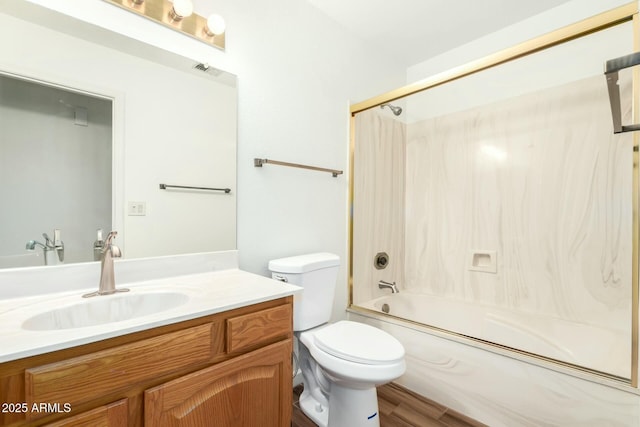 full bathroom featuring vanity, wood-type flooring, shower / washtub combination, and toilet