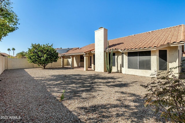 back of property with solar panels