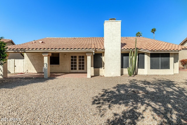 rear view of property with a patio area