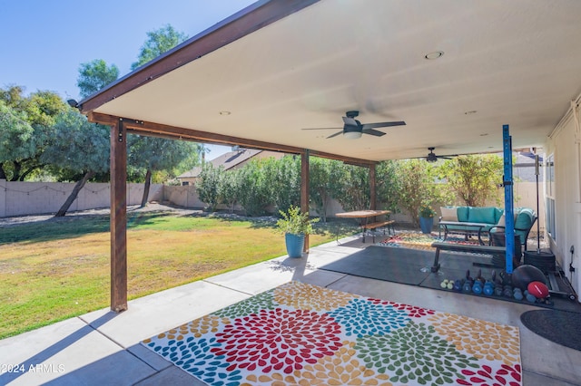 view of patio / terrace with an outdoor living space and ceiling fan