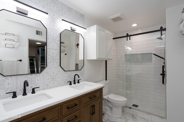 bathroom with vanity, toilet, decorative backsplash, and an enclosed shower