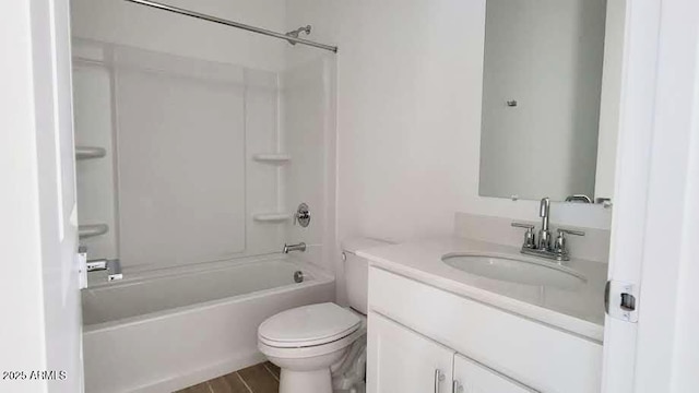 bathroom with vanity, wood finished floors, toilet, and shower / washtub combination