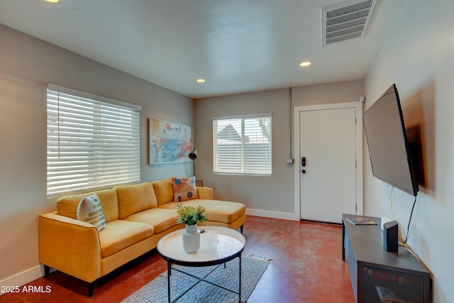 living room with concrete flooring