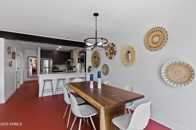 dining area featuring an inviting chandelier