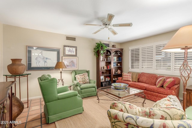 living room featuring light tile patterned floors and ceiling fan