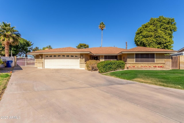 ranch-style home with a garage and a front yard