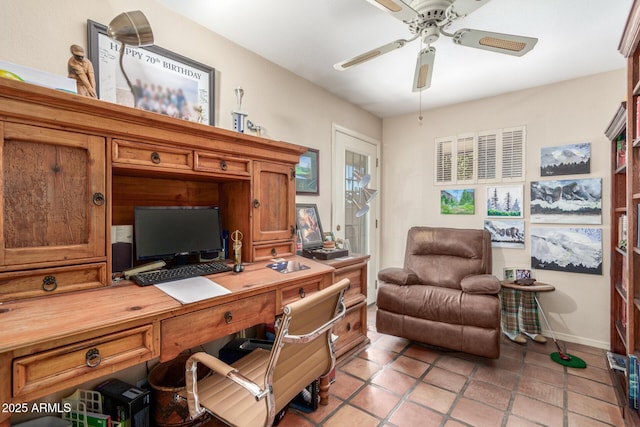 tiled office space featuring ceiling fan