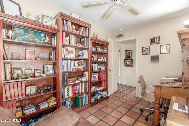 office with tile patterned floors and ceiling fan