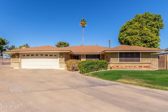 single story home with a garage and a front yard