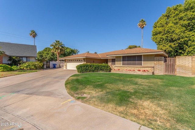 ranch-style house with a garage and a front lawn