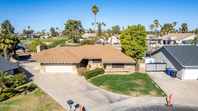 view of front of home featuring a garage and a front yard