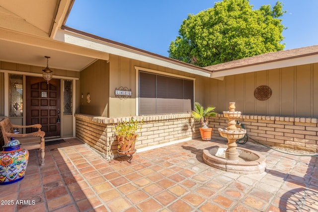 doorway to property with a patio area