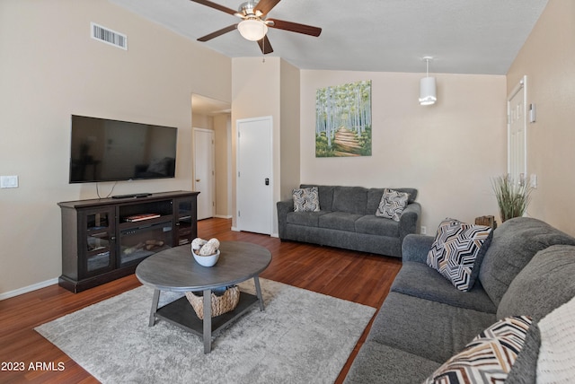 living room with dark hardwood / wood-style floors, high vaulted ceiling, and ceiling fan