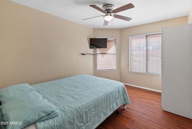 bedroom featuring ceiling fan and wood-type flooring