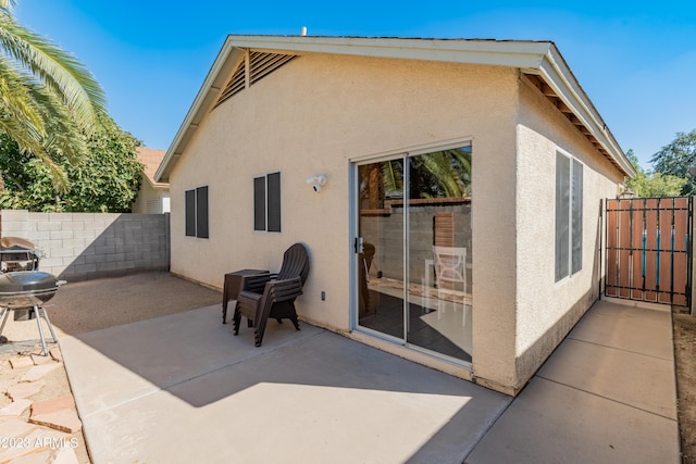 rear view of house featuring a patio area