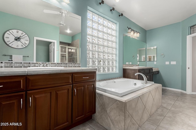 bathroom featuring ceiling fan, tile patterned floors, independent shower and bath, and vanity