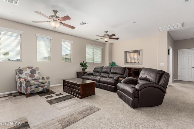 living room with ceiling fan and light colored carpet