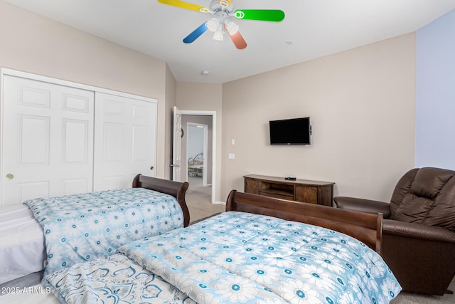 carpeted bedroom with a closet and ceiling fan