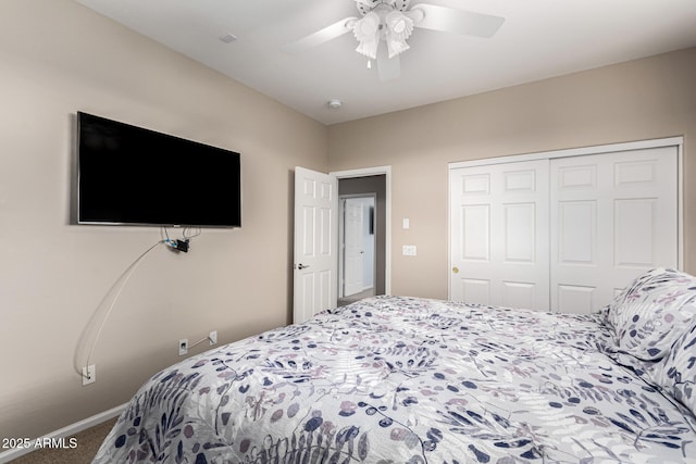 carpeted bedroom featuring a closet and ceiling fan