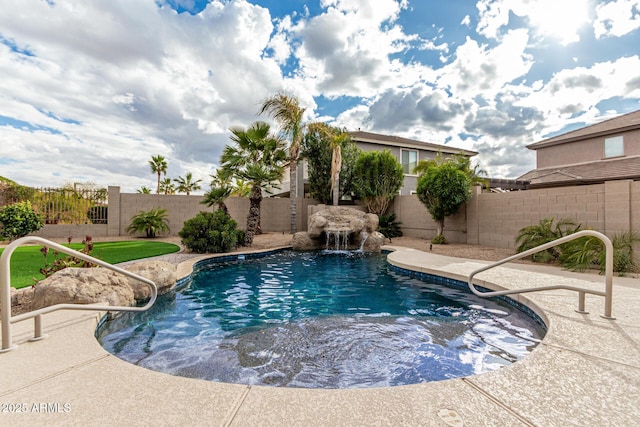 view of pool with pool water feature and a patio area