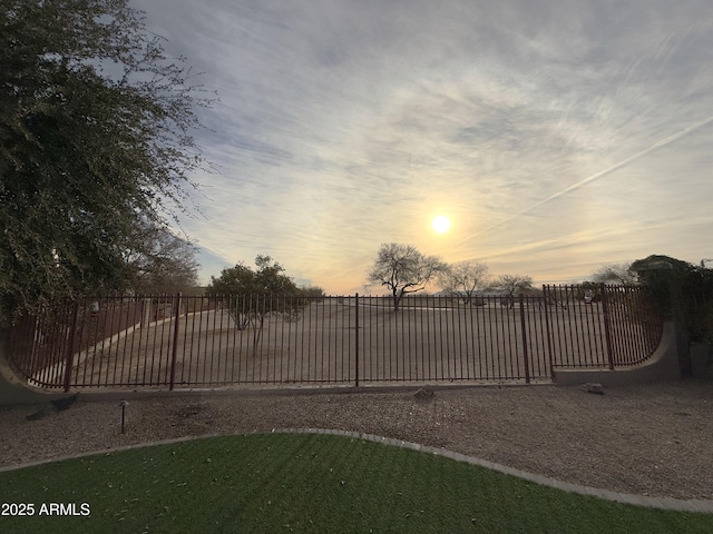 view of gate at dusk