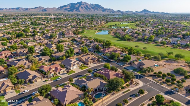 birds eye view of property featuring a water and mountain view