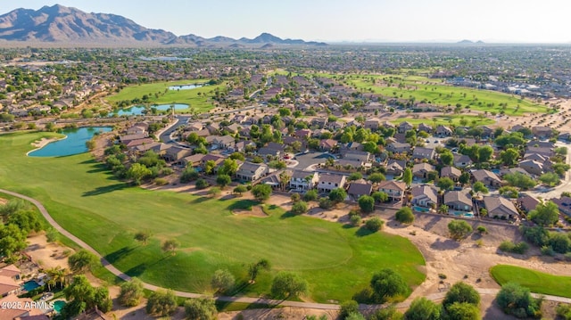 birds eye view of property with a water and mountain view