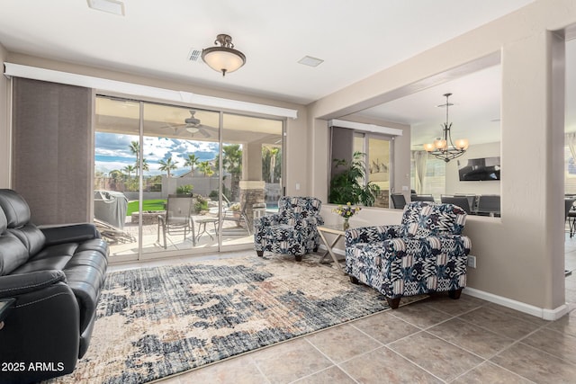 living room featuring a notable chandelier