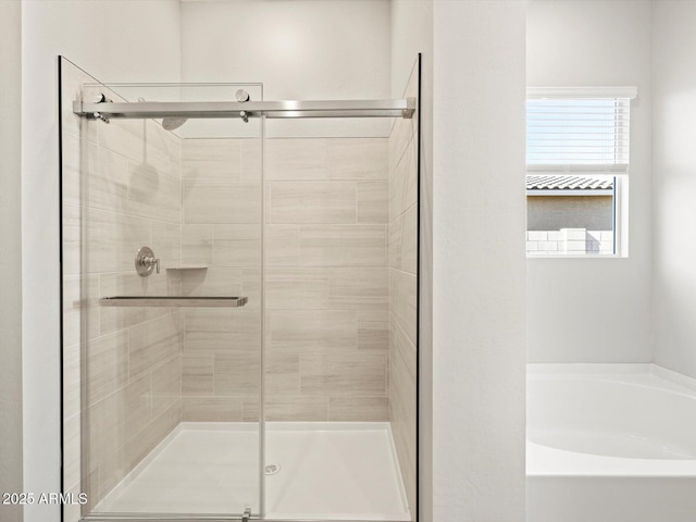 bathroom with independent shower and bath