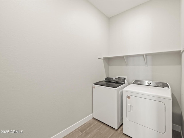 washroom with independent washer and dryer