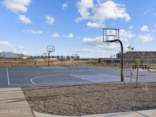 view of basketball court featuring a pergola and a mountain view