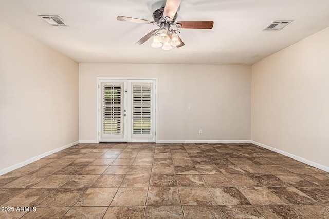2807 N 8th Ave, Phoenix, AZ 85007 - unfurnished room with stone finish floors, baseboards, and ceiling fan