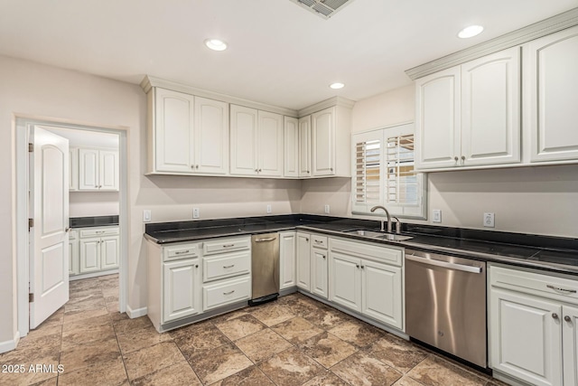 2807 N 8th Ave, Phoenix, AZ 85007 - kitchen with stainless steel dishwasher, a sink, dark countertops, light stone finish floors, and recessed lighting